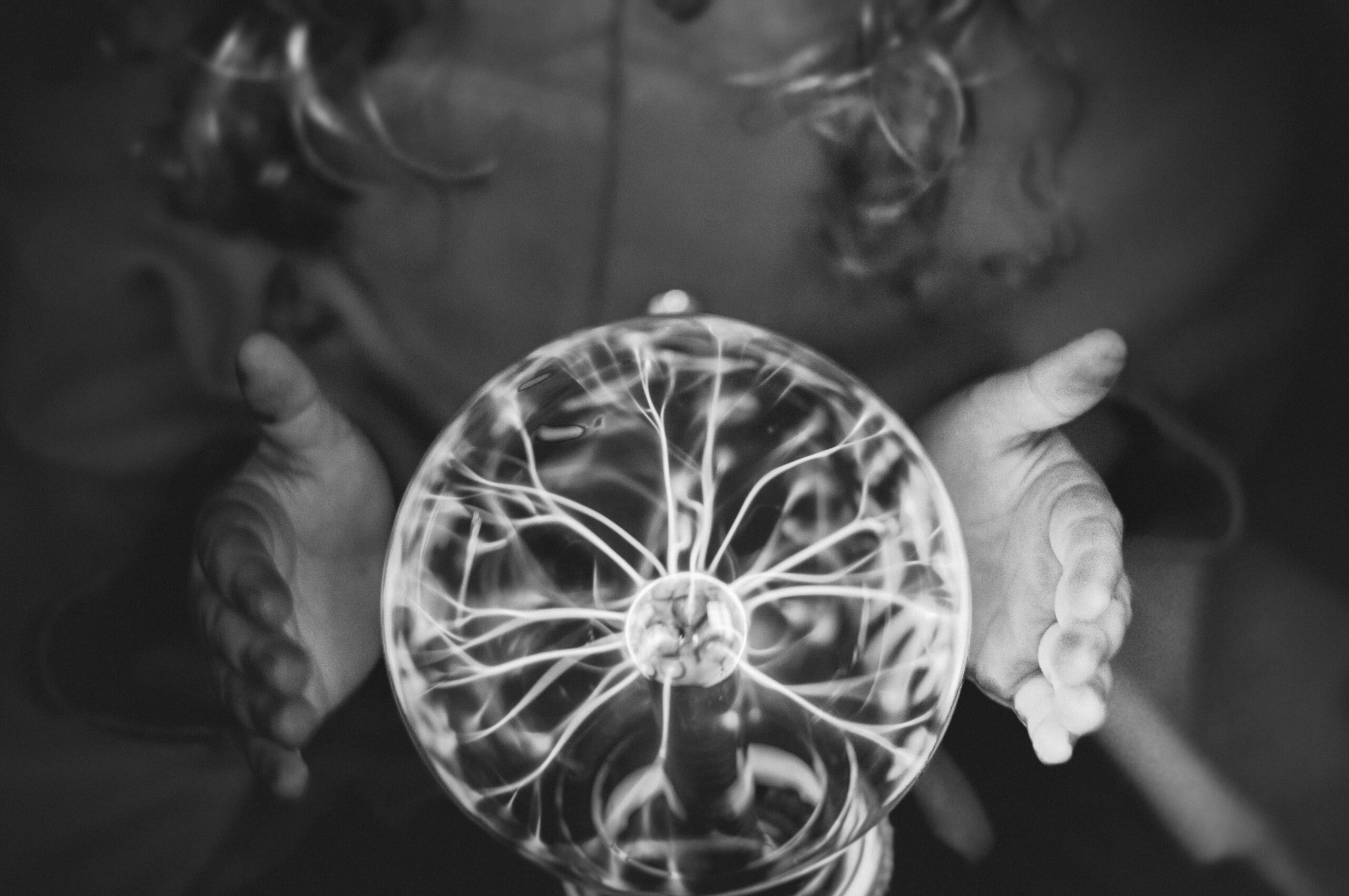 plasma-ball-held-between-hands-in-dark-setting-2026-09-25-08-18-41-utc